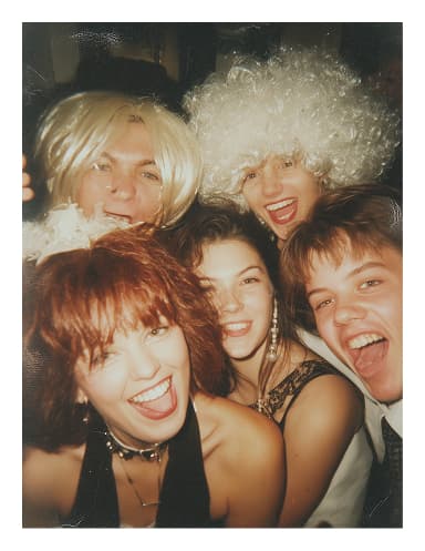 Polaroid photo of two laughing guests
